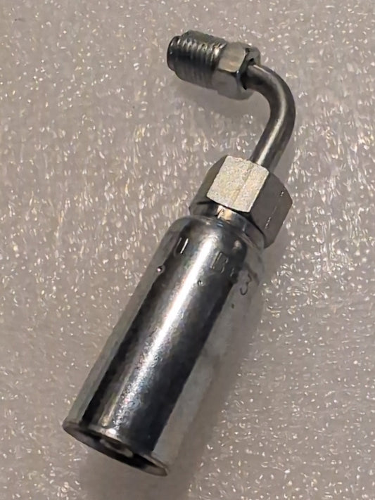 A Weatherhead 04U-B63 1/4 Hose x 3/16 Inverted Male Fitting (CS20-4X3) with a hexagonal nut and angled tube rests on a textured white surface, highlighting the products renowned durability.