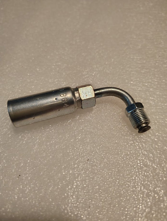 The 04U-B64 Weatherhead 1/4 Hose x 1/4 Inverted Male Fitting (CS20-4X4) features a cylindrical body, hex nut, and bent, threaded end, shown on a textured light-colored surface. Suitable for 100R1 hydraulic hoses.