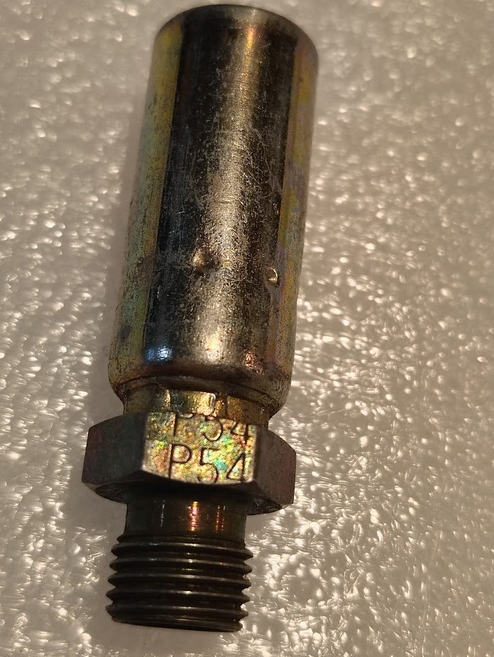 A close-up of a Weatherhead 04U-P54 1/4 Hose x 1/4 BSPT Male Fitting (CS36-4X4), compatible with 100R1, shows engraved markings near its hexagonal section, placed on a textured white surface.