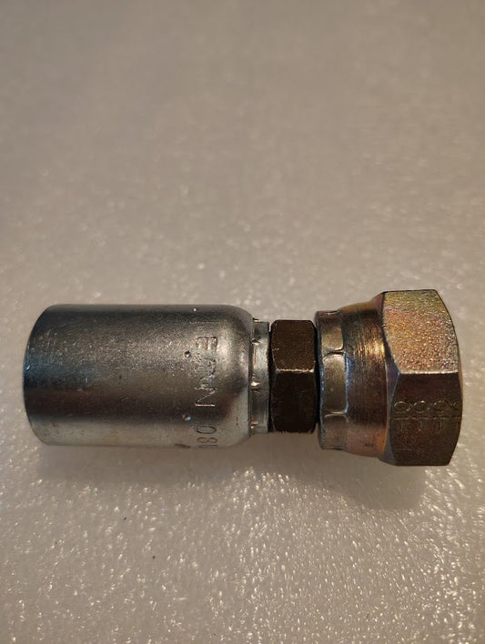 A close-up of the Weatherhead 08U-360 1/2 Hose x 5/8 BSPP Female Fitting (CS10-8X10), featuring a hexagonal nut and crimped end for 100R series hoses, set on a light textured surface.