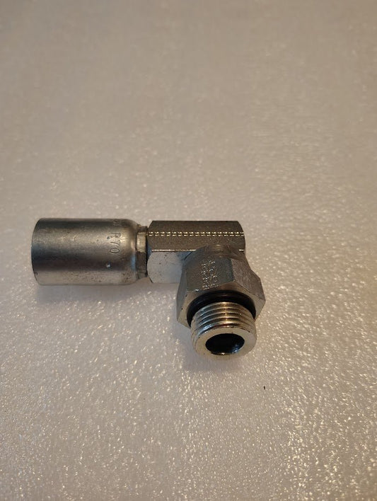 A close-up of the 08U-R70 Weatherhead 1/2 Hose x 5/8 ORB Male Fitting (CS15-8X10) shows its right-angle bend, with one smooth hose connector and one threaded male end, displayed on a textured white surface.