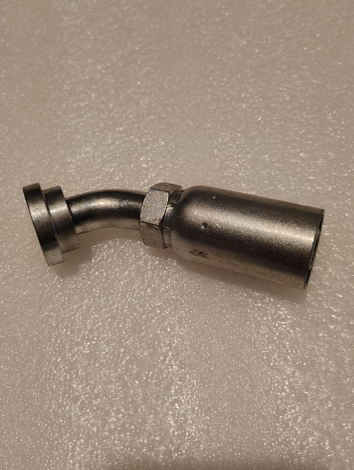 A close-up of a 10U-G69 | Weatherhead 5/8 Hose x M16x1.5 Code 61 Flange Fitting (CS50-10X10) with angled bend and hex nut, set on a textured light-colored surface.