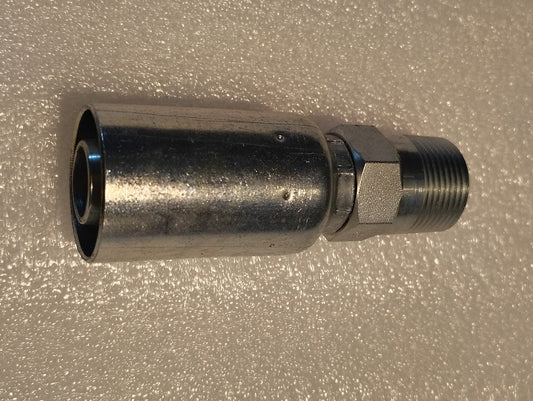 A Weatherhead 12U-162 CS35-12X12 3/4 Hose x 3/4 BSPT Male metal fitting with a hexagonal nut and threaded end lies on a textured white surface, compatible with 100R1 hoses for secure, reliable connections.
