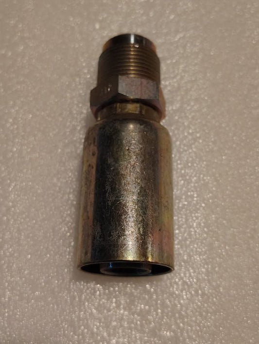 A close-up of the 12U-312 Weatherhead 3/4 Hose x 3/4 SAE Male Fitting (CS06-12X12) with a threaded end on a textured, light surface highlights its compatibility with various Weatherhead fittings.