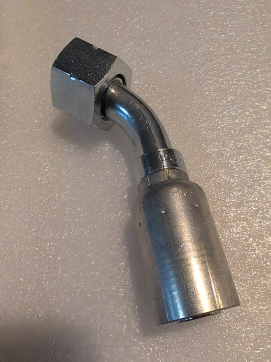 A Weatherhead 12U-L72 hydraulic hose fitting (3/4 Hose x 3/4 ORF Female, CS31-12X12) with a hexagonal nut and bent tube rests on a textured, light-colored surface.