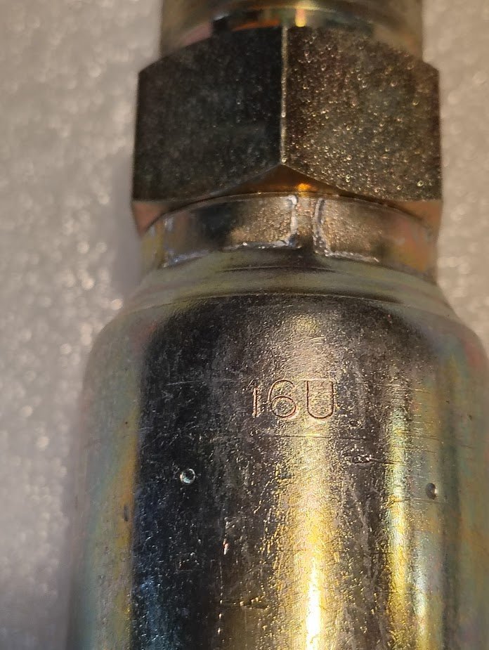 Close-up of the Weatherhead 16U-514 fitting (1 hose x 7/8 SAE male), showing its metallic hex nut and “16U” engraving. Ideal for hydraulic hose systems. Shown against a white, textured background. Product code: CS08-16X14.