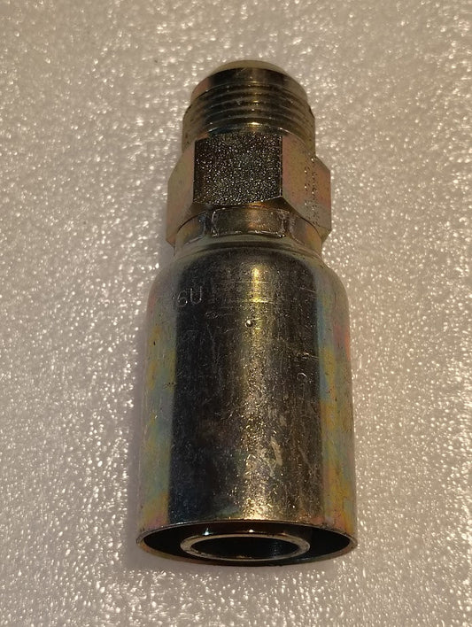 A close-up of the 16U-514 | Weatherhead 1 Hose x 7/8 SAE Male Fitting (CS08-16X14) with a threaded end and hexagonal nut, shown on a textured, light-colored surface.