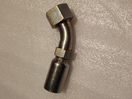 The 16U-L76 | Weatherhead 1 Hose x 1 ORF Female Fitting (CS31-16X16) features a metallic body, 45-degree bend, hex nut end, and cylindrical connector, shown on a textured white surface.