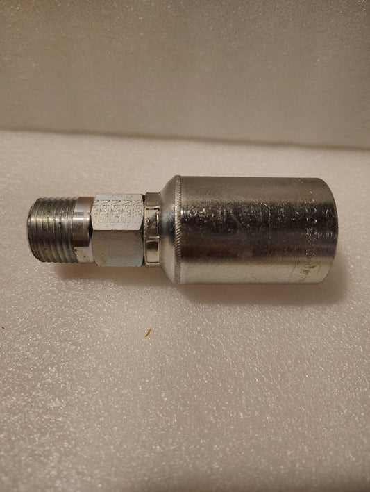 The 43008U-108 Weatherhead 1/2 Hose x 1/2 NPTF Male Fitting (GW01-8x8) features a threaded male end and large cylindrical body, shown lying on a textured white surface.