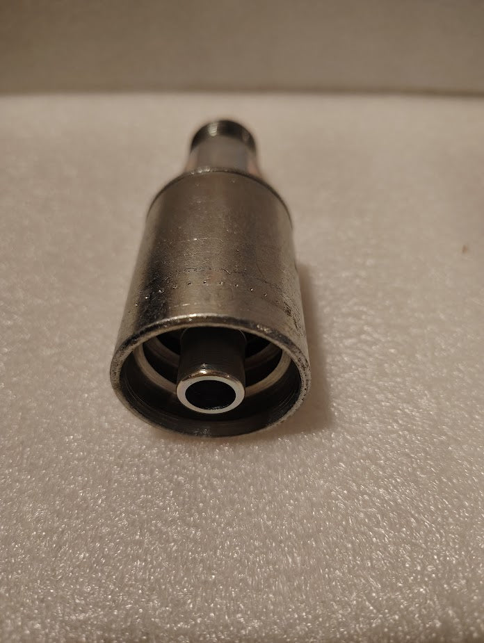 A close-up of a Weatherhead 43008U-108, a 1/2 hose x 1/2 NPTF male fitting (GW01-8x8), shows the metal cylindrical part resting on a textured white surface, used for connecting compatible hydraulic hoses.