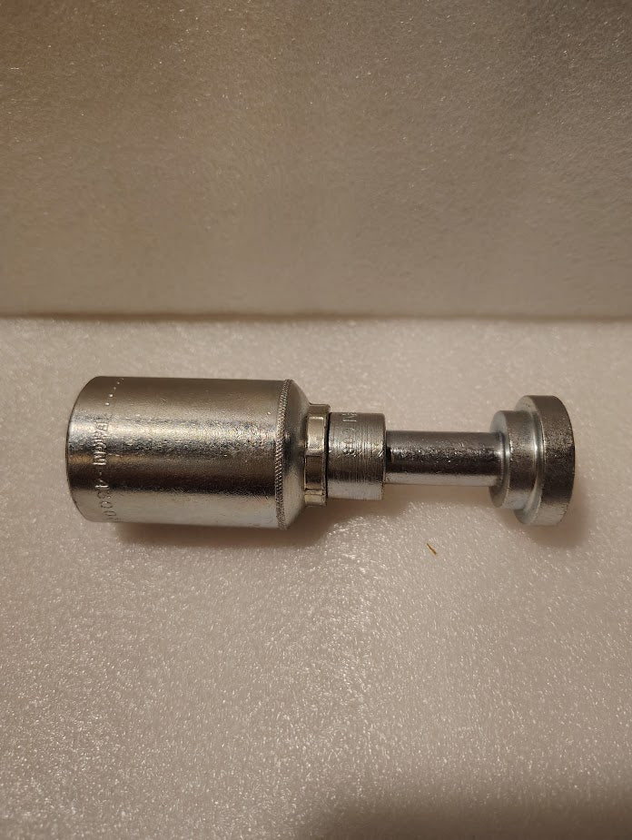 The 43008U-G08 Weatherhead 1/2 Hose x 1/2 Code 61 Flange Fitting (GW47-8x8) sits on a textured white surface, featuring a metallic cylindrical body with a threaded shaft and round, flat end.