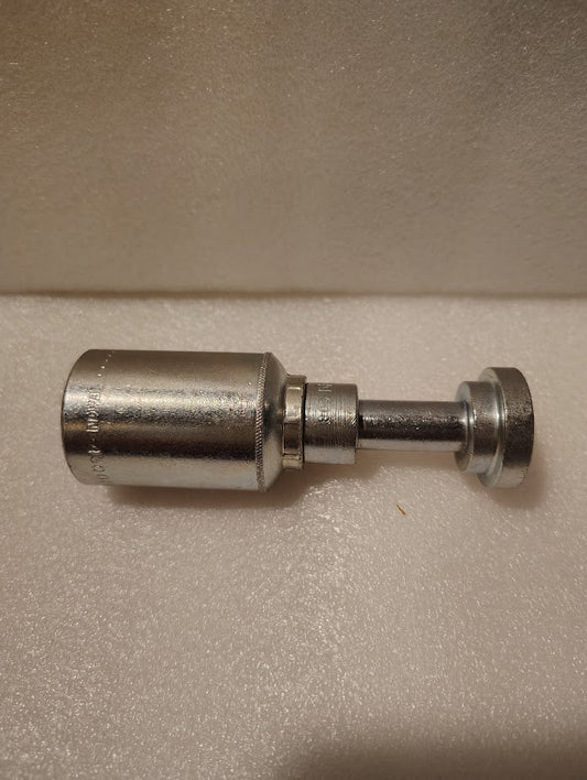 The 43008U-G08 Weatherhead 1/2 Hose x 1/2 Code 61 Flange Fitting (GW47-8x8) sits on a textured white surface, featuring a metallic cylindrical body with a threaded shaft and round, flat end.