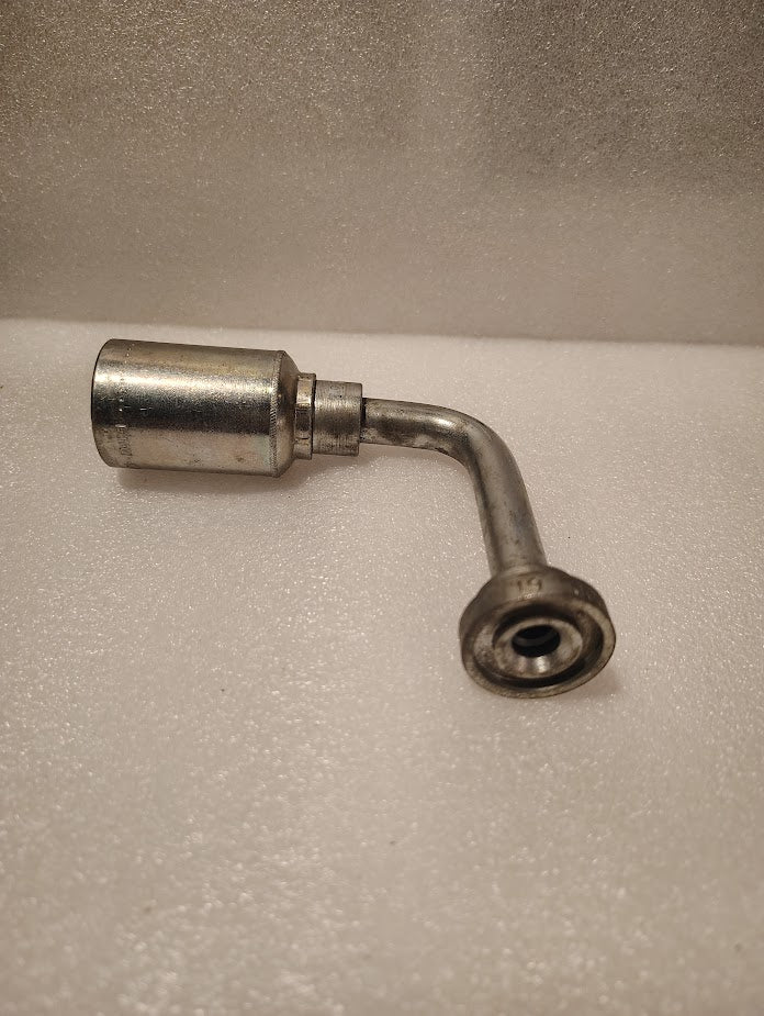A 43008U-G71L32 | 1/2 Hose x 1/2 Code 61 Flange Fitting - 90 Long bend (GW54-8x8) is shown with a cylindrical hose end and a Code 61 flange, placed on a textured white surface.