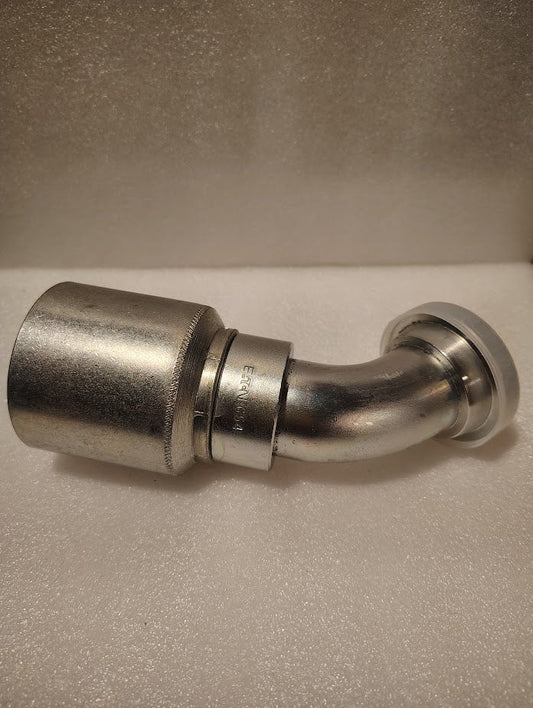 A 1 1/2 hose x 1 1/2 Code 61 flange fitting with a 45-degree bend (43024U-G54 | GW50-24x24) rests on a textured white surface—perfect for applications needing this specific Weatherhead hydraulic fitting.