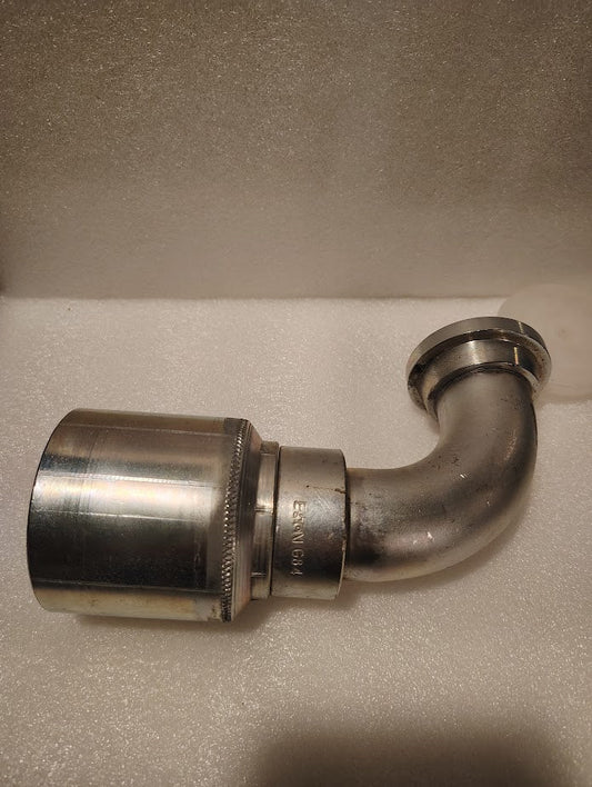 A 43024U-G84 | 1 1/2 Hose x 1 1/2 Code 61 Flange Fitting with a 90° bend (GW53-24x24), similar to hydraulic hose fittings, is shown on a white textured surface.