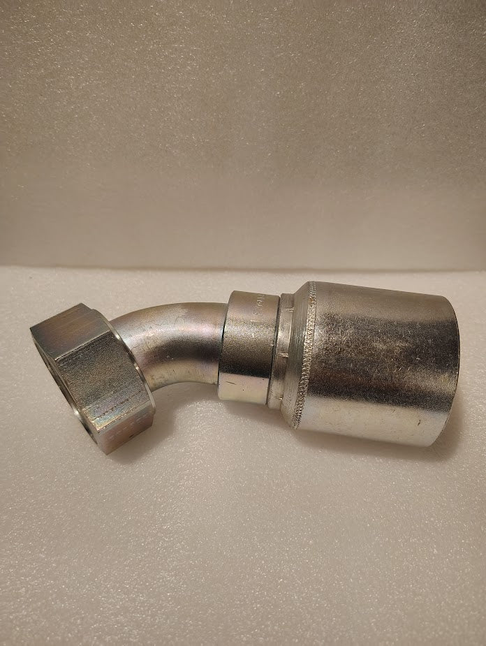 A 1 1/2 hose x 1 1/2 ORFS swivel fitting (GW31-24x24), metallic with a hex nut and a 45-degree bend, rests on a light textured surface.