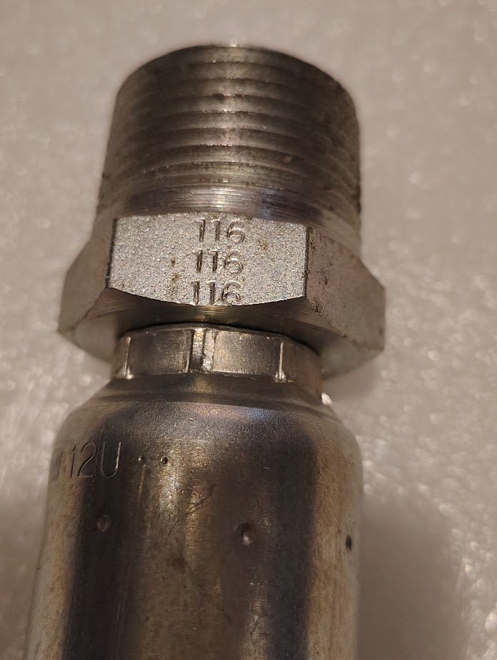 A close-up of a metallic 12U-116 pipe fitting shows a threaded end with 116 116 116 engraved on its hexagonal section. Compatible with Weatherhead fittings, the surface is textured and shiny.
