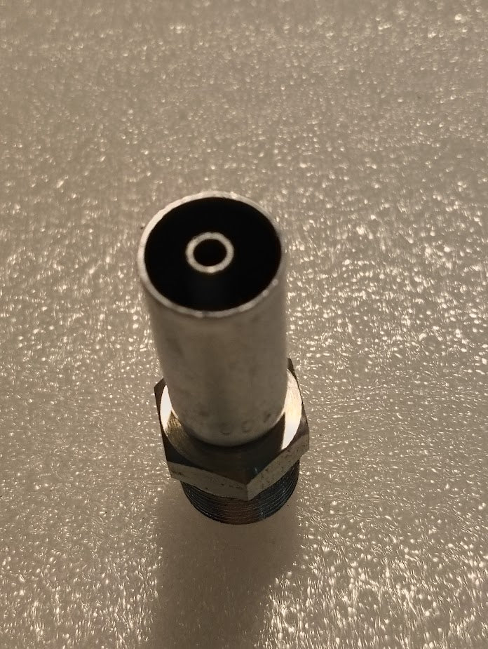 A close-up shows the 04U-108 Weatherhead 1/4 Hose x 1/2 NPTF Male Fitting with a cylindrical top and hexagonal base on a textured white surface. The lighting casts slight shadows, highlighting the meticulous details of this straight solid fitting.