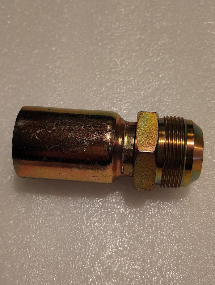 The 16U-520 Weatherhead fitting, a solid straight metallic hydraulic hose fitting compatible with 100R1, features a cylindrical body and threaded end. It rests on a speckled light surface with a shiny, reflective finish and is viewed from the side.
