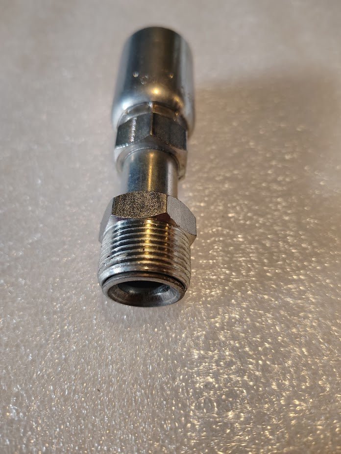 A close-up image features a shiny metallic 08U-B10 Weatherhead fitting with threaded ends and a hexagonal nut, resembling Parker fittings, on a textured surface. The gleaming 1/2 hose x 5/8 inverted male straight swivel fitting reflects light, showcasing its robust construction.
