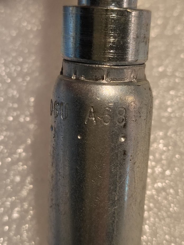 A metallic 06U-A68 Weatherhead 3/8 Hose x 1/2 ORF Female Fitting (CS33-6X8) with engraved markings is shown close-up against a textured white background, commonly used in hydraulic hose fittings.