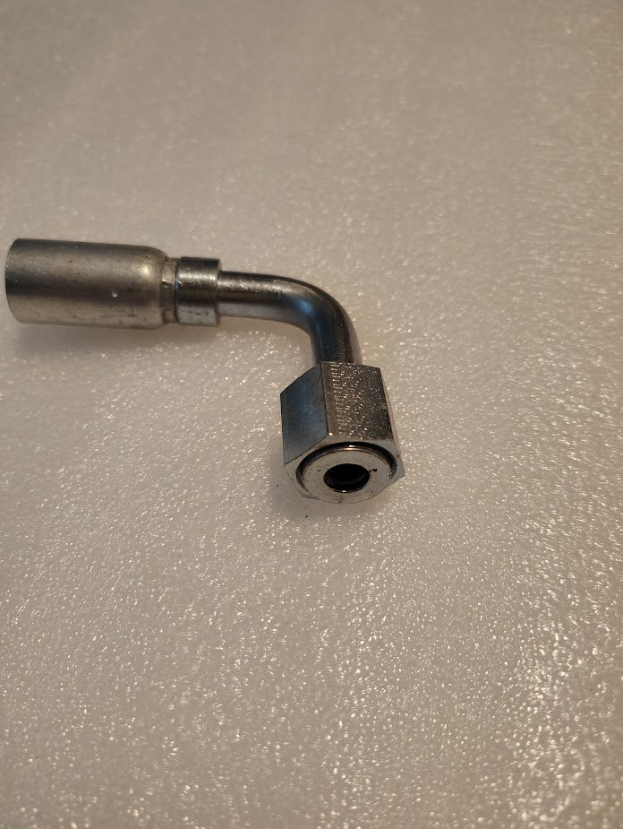 The 06U-A68 Weatherhead 3/8 Hose x 1/2 ORF Female Fitting (CS33-6X8) is a metal L-shaped pipe fitting with a hex nut and cylindrical connector, perfect for compatible hoses and Weatherhead systems.