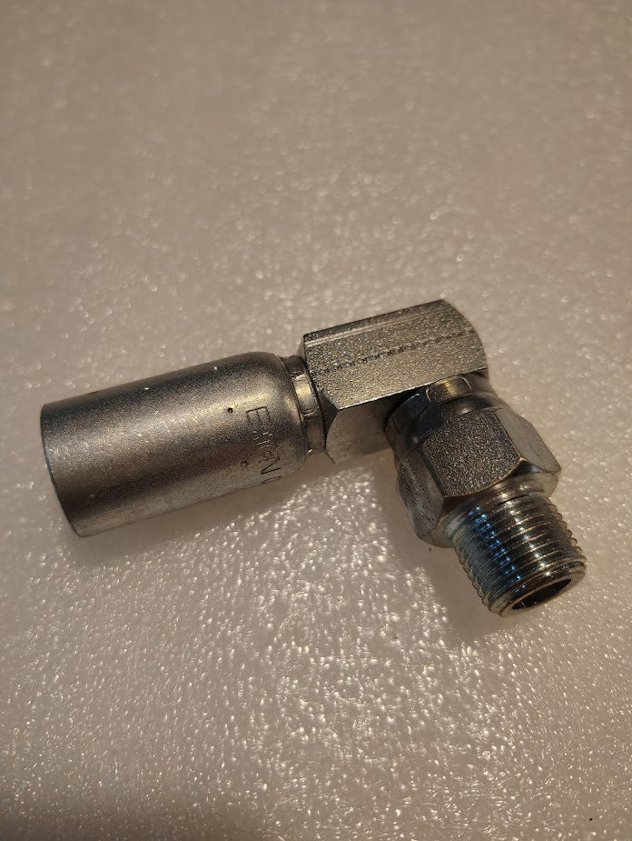 A close-up of the 06U-M06 Weatherhead 3/8 Hose x 3/8 NPTF Male Fitting (CS14-6X6) with a threaded male end, shown on a textured white surface, compatible with Couplamatic interchanged and Weatherhead fittings.