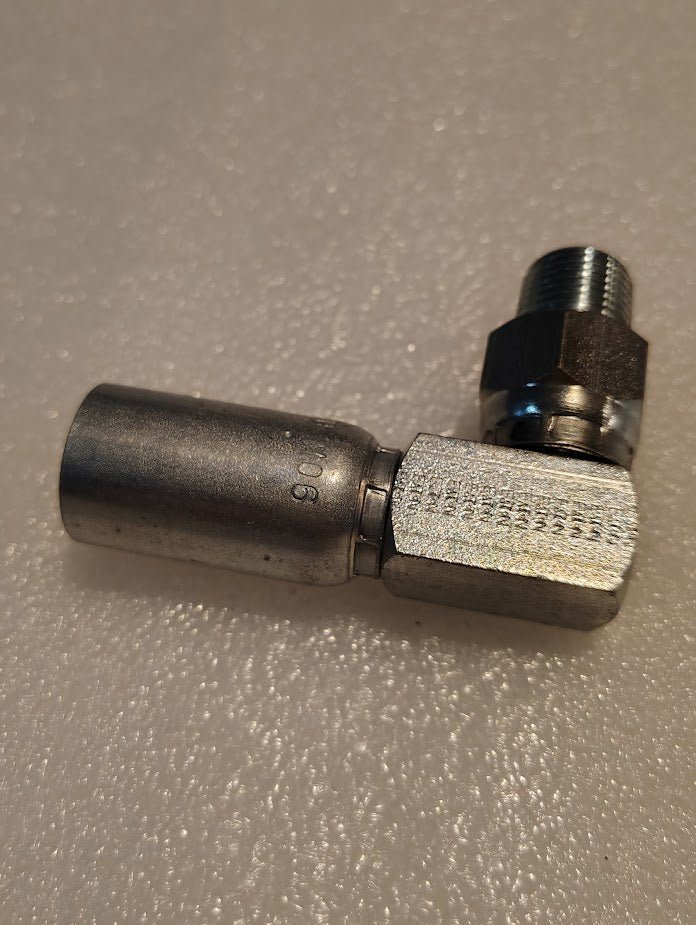 A Weatherhead CS14-6X6 06U-M06 hydraulic hose fitting, 3/8 hose x 3/8 NPTF male with a 90° elbow and hex nut, rests on a textured white surface—compatible with Couplamatic interchanged fittings.