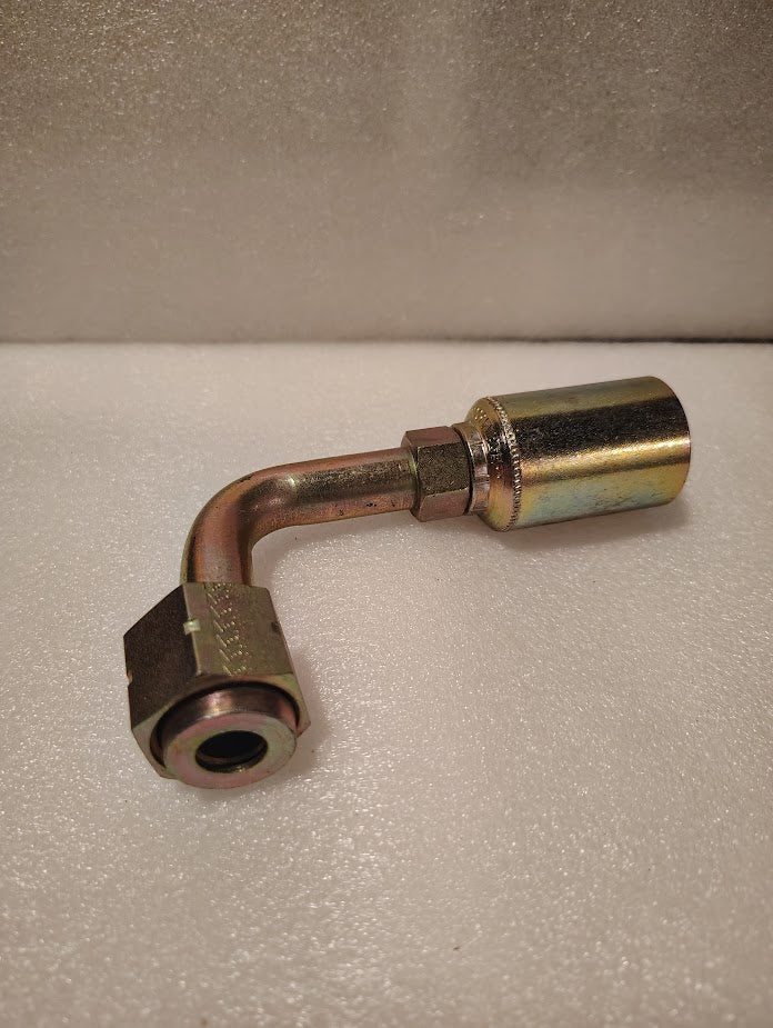 A 43008U-A70 | 1/2 Hose x 5/8 ORFS Swivel Fitting - 90 Long bend (GW33-8x10), metal hydraulic fitting with a hex nut and cylindrical ferrule, rests on a white textured surface.