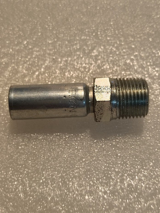 A Weatherhead 04U-108 1/4 Hose x 1/2 NPTF Male Fitting with a ridged threaded end and smooth cylindrical body rests on a textured, light-colored surface, ideal for compatible hoses.