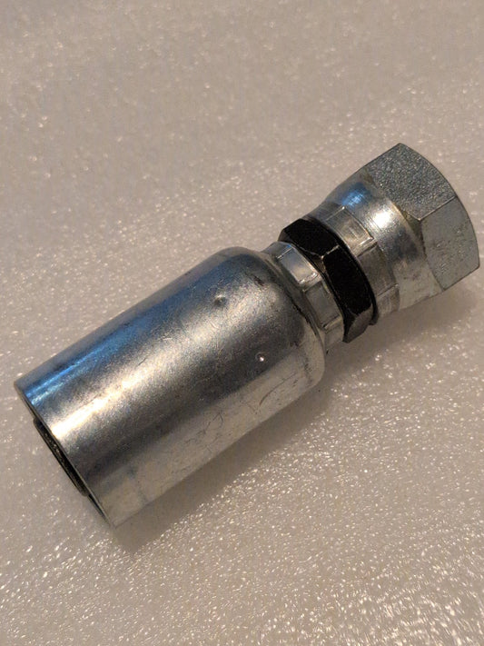 Close-up of a 12U-362 Weatherhead fitting, featuring a hexagonal end and cylindrical body on a textured white surface, highlighting the precision typical of hydraulic hose fittings.