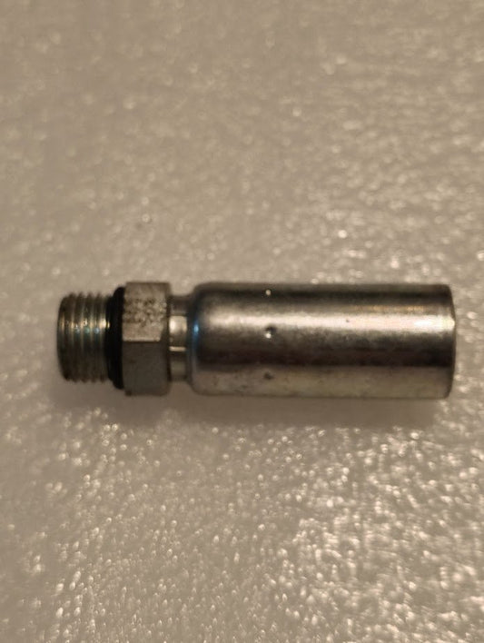 A metallic 04U-P06 Weatherhead hose fitting, featuring a cylindrical shape with a threaded end and hexagonal base, rests on a textured light surface, showcasing its compatibility with Weatherhead fittings.