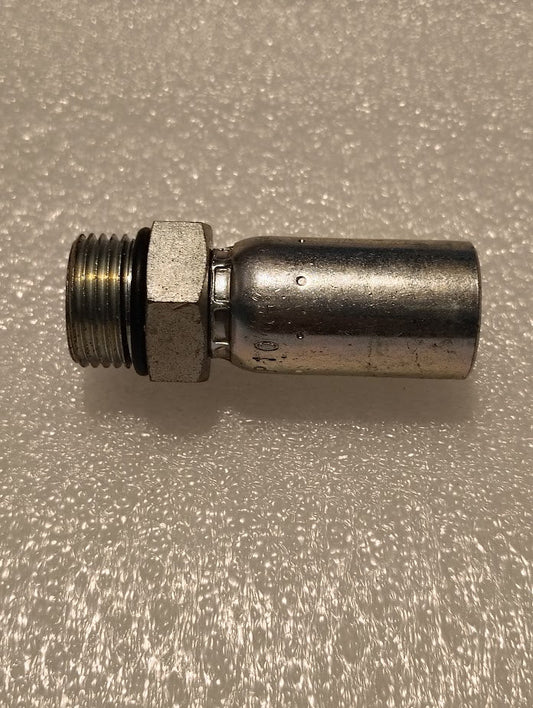 The 06U-P10 Weatherhead fitting, featuring a cylindrical shape with a hexagonal section and threaded ends, sits on a textured white surface. It is perfect for connecting plumbing or industrial pipes with hydraulic hoses due to its excellent interchangeability.