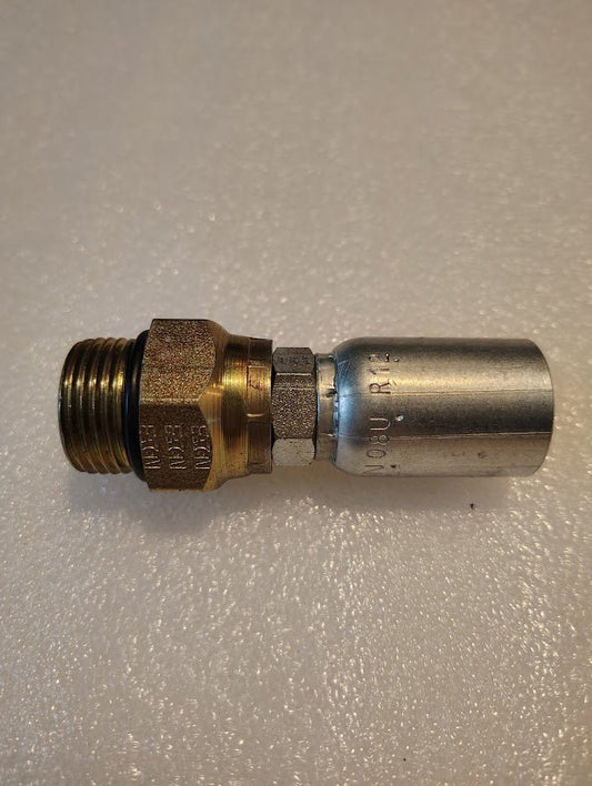 The 08U-R12 Weatherhead fitting is on a textured white surface, showcasing its threaded brass and smooth silver sections with engraved markings, ideal for hydraulic hoses.