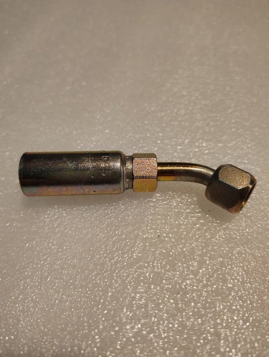 The 04U-685 Weatherhead 1/4 Hose x 5/16 JIC/SAE Female Fitting - 45 Swivel has a right-angled bend, hexagonal nut connector, and a shiny textured surface that stands out against the rough background.
