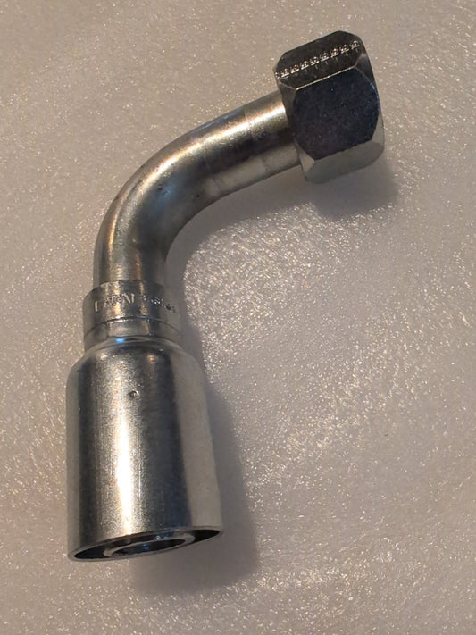 The Weatherhead 16U-656L33 is a silver metallic, curved hydraulic fitting compatible with Parker and Weatherhead. It has a hexagonal nut on one end and a cylindrical connector on the other, with a 90-degree long swivel design.