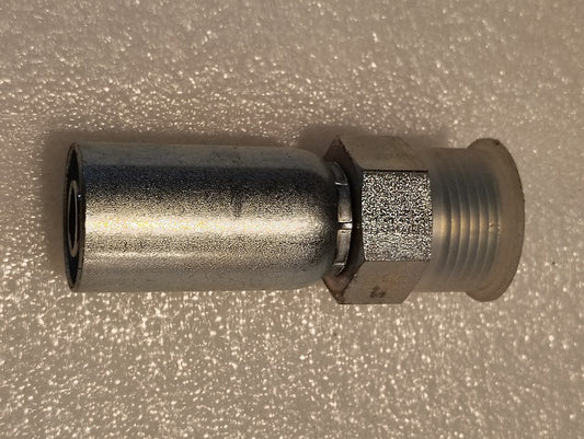 The 10U-E72 Weatherhead 5/8 Hose x 3/4 ORF Male Fitting is a straight solid metal fitting with a hexagonal nut section, compatible with 100R1, featuring threaded ends and a smooth cylindrical body lying flat on a textured white surface.