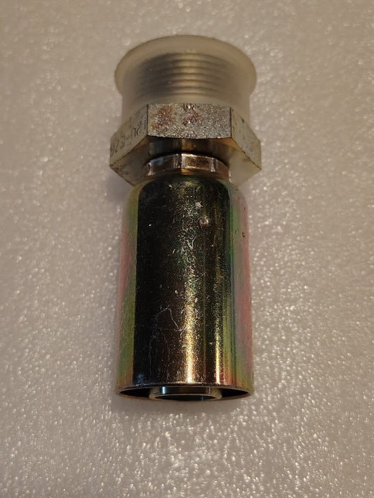 A close-up shows a 12U-E76, a Weatherhead fitting, against a textured light-colored background. It features a cylindrical lower section with a reflective finish and a wider threaded top section, connected by a hexagonal nut.