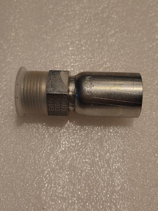 The 08U-E70 Weatherhead 1/2 Hose x 5/8 ORF Male Fitting, featuring a threaded end and hexagonal connection, is ideal for your hydraulic hose, shown on a textured white surface.