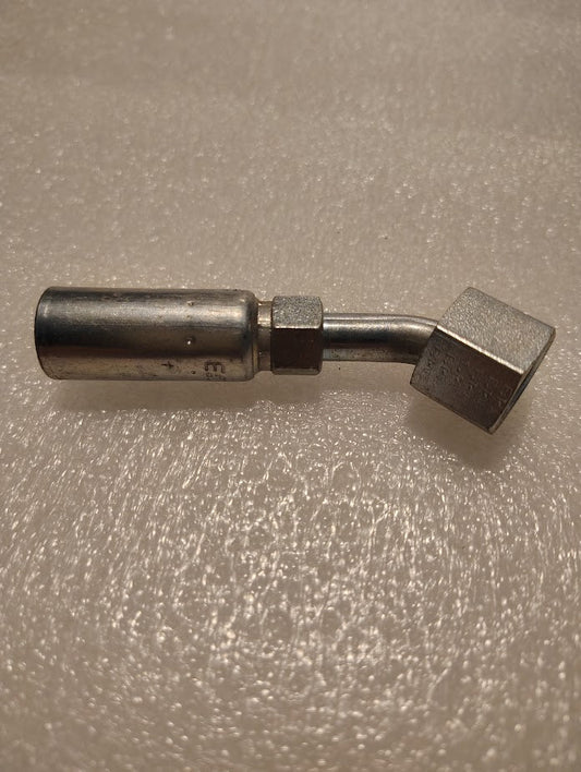 The 04U-L66 Weatherhead fitting, designed for 100R1 hoses, has a straight cylindrical end and a hexagonal nut end. Positioned on a textured surface, this hydraulic hose fitting includes a subtle bend near the nut and features a 45-degree swivel.