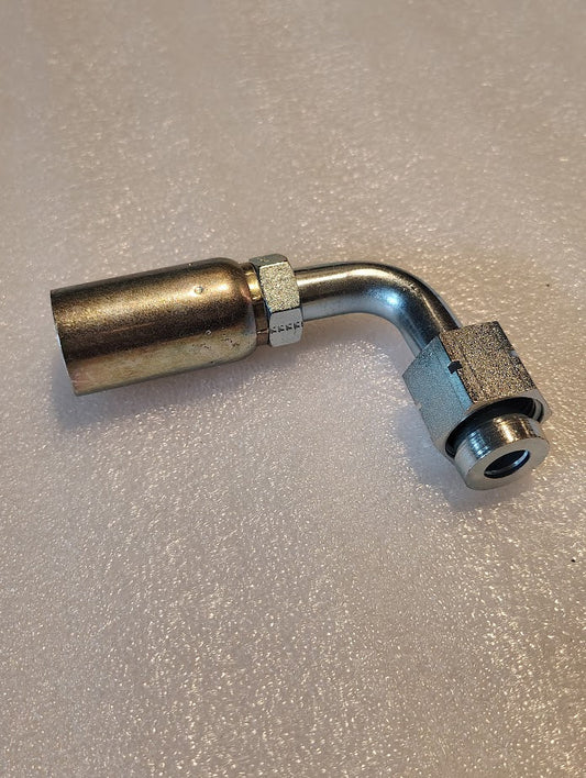 The 10U-A70 | Weatherhead 5/8 Hose x 5/8 ORF Female Fitting - 90 Long Swivel, with an elbow joint and threaded connection, rests on a textured surface. It is designed for seamless integration with compatible hydraulic hoses and fittings.