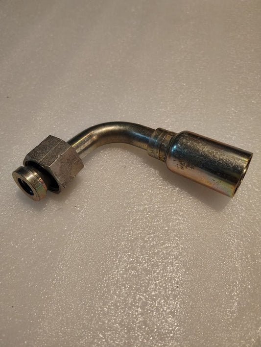 The 12U-A72, a metallic Weatherhead 3/4 Hose x 3/4 ORF Female Fitting with a threaded end and wider cylindrical connector, is ideal for 100R1 hydraulic hose fittings. It sits on a textured light-colored surface.
