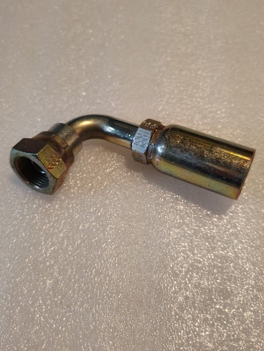 The 10U-80P Weatherhead fitting, a 5/8 BSPP female with a 90-degree swivel, rests on a textured light surface. This metallic hydraulic fitting features a hexagonal nut and cylindrical connector for versatile hose compatibility.